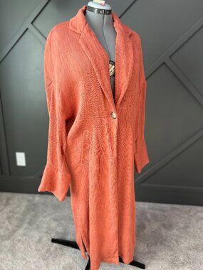 Pleated one-button summer jacket with bell cuffs and pockets in dusty orange